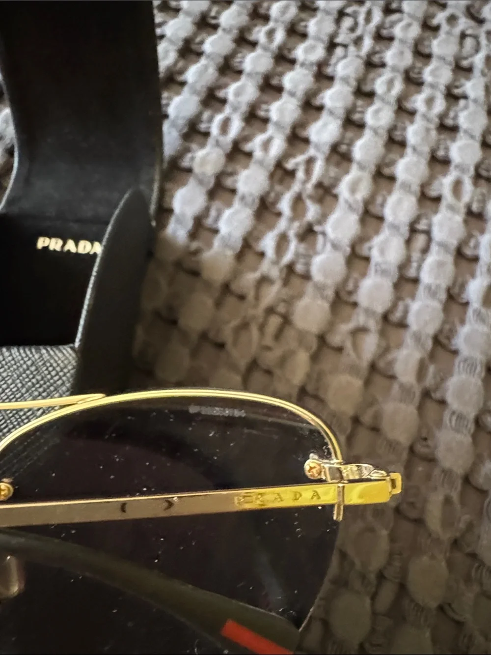 Prada Gold Frame Sunglasses with Orange-Red Mirrored Lenses